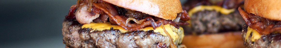 Eating American (Traditional) Burger at Burger Barn restaurant in San Jose, CA.